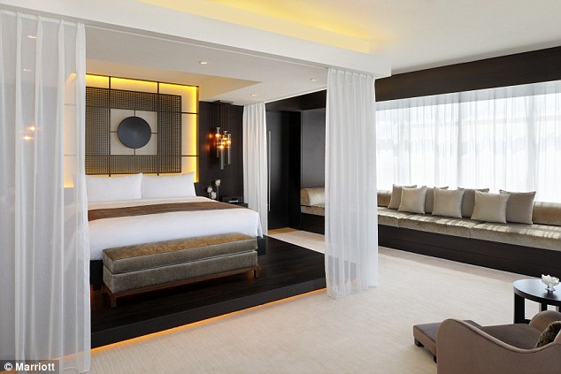 Luxurious: The large bedroom offers a modern take on the four-poster bed